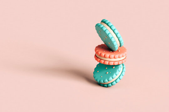 Cookies balanced on a pink background with copy space