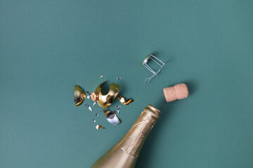 Bottle of champagne, corks and broken bauble