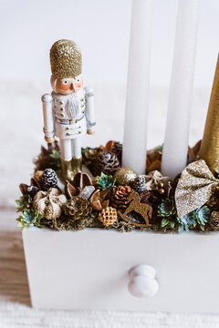 Christmas decoration with natural components and a wooden nutcracker soldier