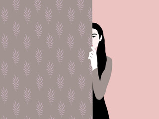 Woman hiding behind a wall