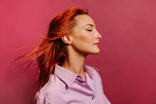 Beautiful ginger woman with long red hair