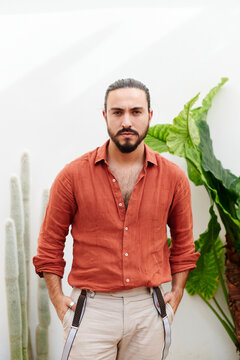Confident young man standing outside