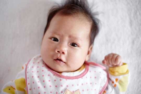 Closeup expression of Asian newborn baby