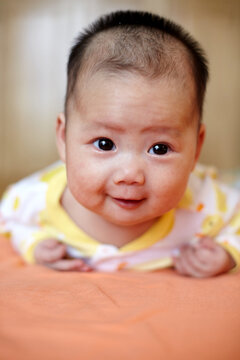 Closeup of Asian baby expression

