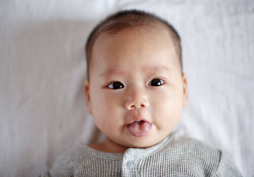 Closeup expression of Asian newborn baby