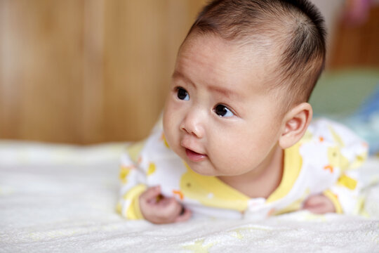 Closeup of Asian baby expression

