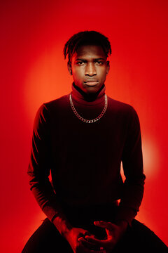 Black guy sitting in front of camera