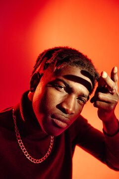 African American guy gesturing ans looking at camera
