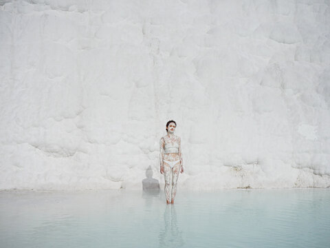 Portrait of a woman with white clay at thermal pool