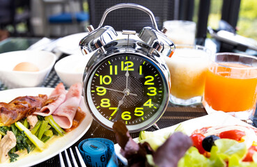 Diet plan with alarm clock as Interval fasting  Healthy diet concept