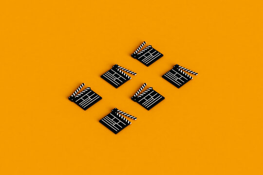 clapperboards isolated on orange background. 3d render