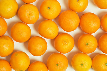 Background fresh tangerines top view, fruits and citrus fruits.