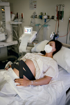 Pregnant woman being monitored before giving birth.