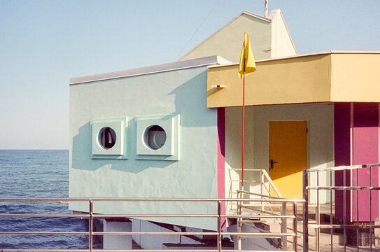Pastel color seaside kiosk with round square windows