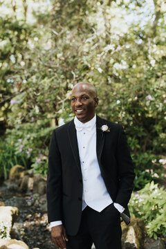 Portrait of Smiling Groom in Woods