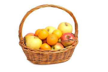 Fruits, apples and tangerines in a wicker basket on white background.