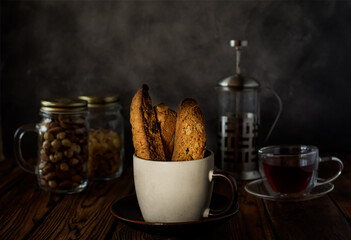 Homemade Italian cranberry and nuts biscotti with cup of tea