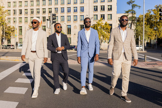 Black Men In Suits Walking On The Street