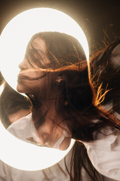 surreal portrait of a girl with glowing halo disc