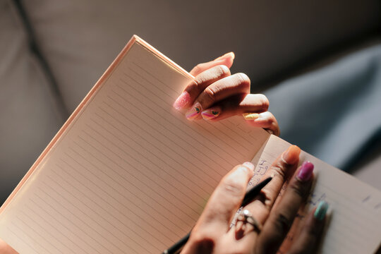 Hands holding a diary