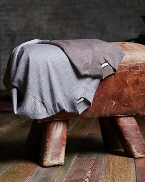 Stylish turtlenecks on ottoman