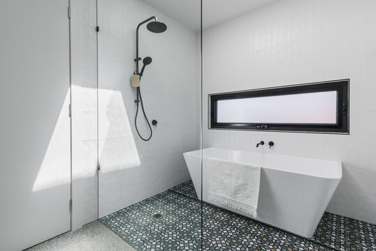 White bathroom shower and bath