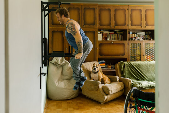 Man With A Disability Exercising At Home