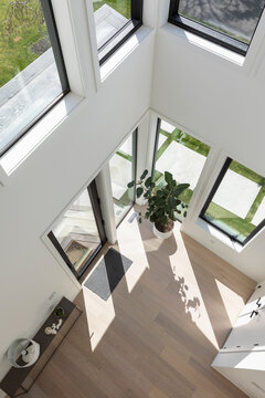 View down to front door in foyer of Modern Home 