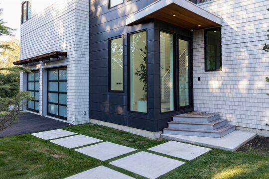 Contemporary home Front Door with garage 