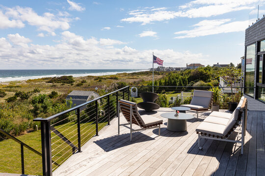 Patio Furniture on deck of modern summer home