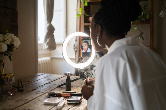 Black Woman Making Up In Front Of A Ring Light.