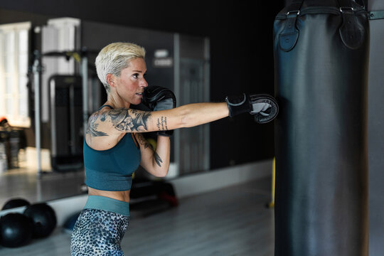 Woman training boxing at gym 