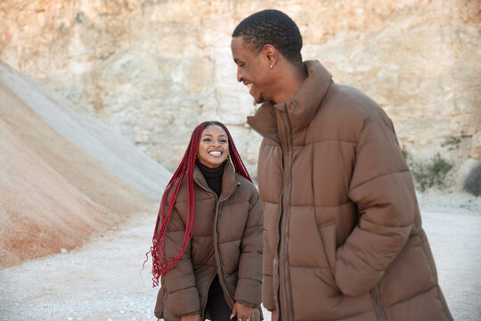 Couple laughing with complicity at desert