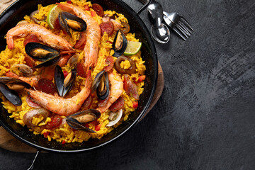 Seafood Paella on gray background.