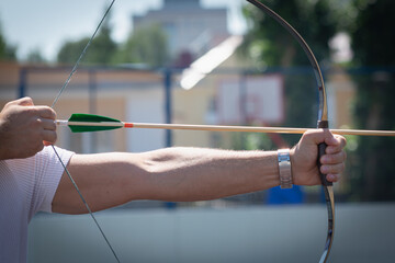 The archer drew on the bowstring. Preparing for archery.