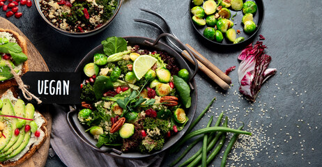 Vegan dishes assortment on gray background.