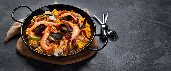 Seafood Paella on gray background.