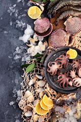 Fresh seafood arrangement on dark background.