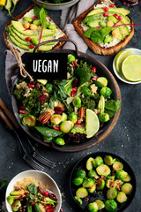 Vegan dishes assortment on gray background.