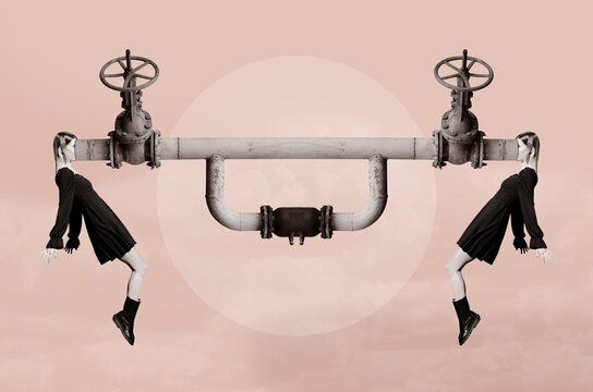 Two women in black dresses with faces inside a pipe