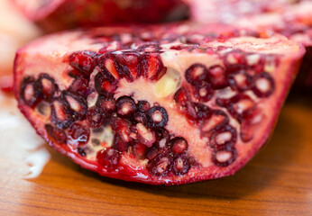 Detail of fresh sliced pomegranate fruit with seeds