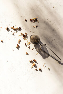 Loose leaf herbal tea near tea strainer