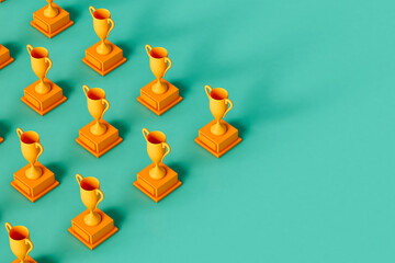 copy spaced image of Yellow trophy on green background