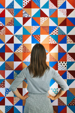 Woman on patchwork background.