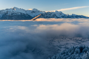 An alpine city under the fog inversion