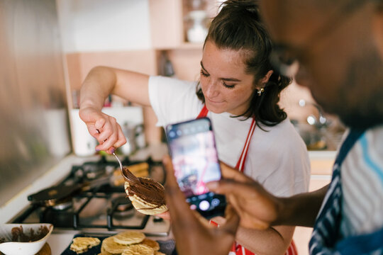 Couple of Influencers Cooking at Home - Powered by Adobe