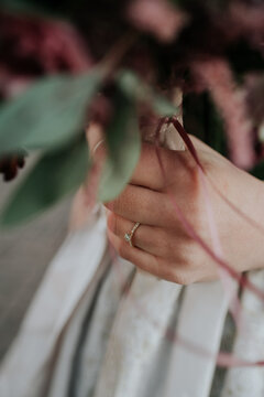 Glittering diamond engagement ring on the hand of a bride