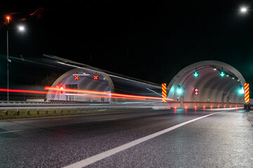 Light trails of vehicle at the tunnel entrance 