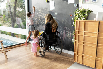 Mother with a disability enjoying with her daughters