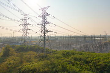 Aerial view of electricity generating, voltage poles. Power lines on utility tower and cable wires in energy electric technology, network, and industry. Generator pylon. Transmission and substation.